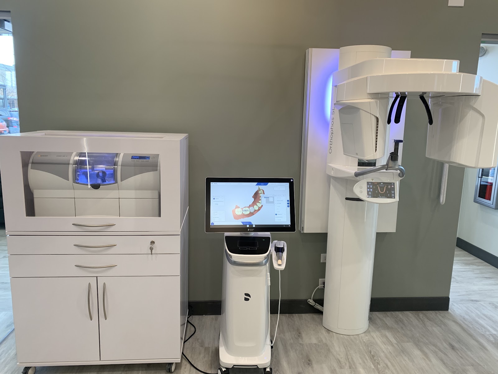 Digital dental technology at Best Dental Spa — a milling unit, a 3D scanner cart, and a panoramic X-ray unit